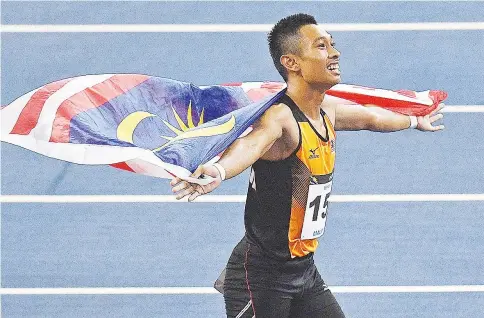  ??  ?? Malaysia’s Khairul Hafiz celebrates after winning the men’s 100m athletics final of the 29th Southeast Asian Games (SEA Games) at the Bukit Jalil national stadium in Kuala Lumpur on August 22, 2017. - AFP photo