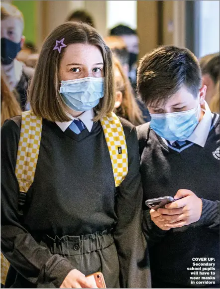  ?? Picture: JANE BARLOW/PA ?? COVER UP: Secondary school pupils will have to wear masks in corridors