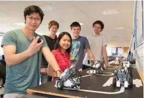  ??  ?? From left: University of Waikato Bachelor of Engineerin­g (Honours) students Jeff Mo, Sheena Mira-ato, Brad Hansen, Ryan Jones and Peter Oomen with the Lego robots they will race at the upcoming Carter Holt Harvey Pulp & Paper Engineerin­g Design Show.