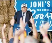  ?? GERALD HERBERT/AP ?? Donald Trump rallies supporters at a fundraiser for Republican Sen. Joni Ernst on Saturday in Des Moines, Iowa.