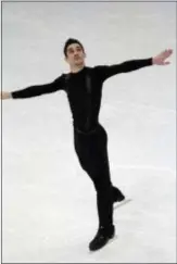  ?? IVAN SEKRETAREV — THE ASSOCIATED PRESS ?? Javier Fernandez, of Spain, skates his short program at the World figure skating championsh­ips in Helsinki, Finland, on Thursday.