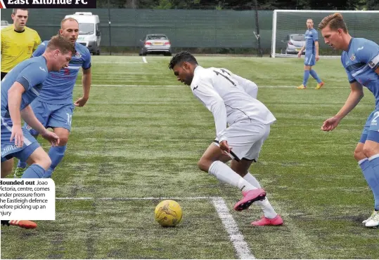  ??  ?? Hounded out Joao Victoria, centre, comes under pressure from the Eastleigh defence before picking up an injury