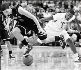  ?? AP Photo ?? Duke’s Austin Rivers, left, and Temple’s Khalif Wyatt chase after a loose ball during Wednesday night’s game at the Wells Fargo Center.