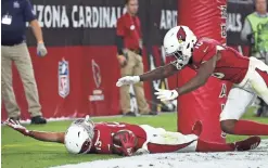  ??  ?? Cardinals wide receiver Christian Kirk, left, celebrates with Chad Williams after catching a touchdown pass.