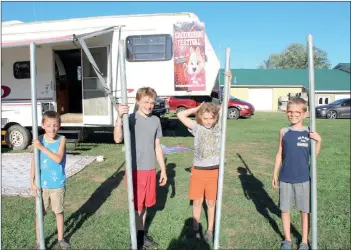  ?? Photo by Larry McGuire/The Punxsutawn­ey Spirit ?? Helping with setup for the Groundhog Festival on Friday at Yoder’s Antique Mall in Hudson were (from left) Carter Clark, Owen Storey, Sage Saxton and Cody Clark.