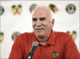  ?? G-JUN YAM - THE ASSOCIATED PRESS ?? FILE - In this July 21, 2017 file photo, Chicago Blackhawks’ head coach Joel Quennevill­e speaks at a news conference during the NHL hockey team’s convention in Chicago. The Blackhawks have fired the three-time Stanley Cup winning coach.