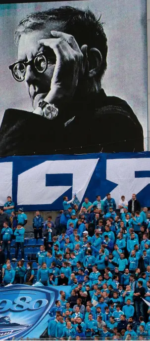  ??  ?? Crowd pleasers: (left) Zenit Saint Petersburg fans beneath a giant portrait of Shostakovi­ch, 2016; (above) might Bliss’s score Things to
Come inspire Arsenal to greatness?