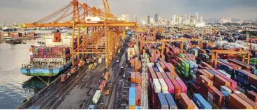  ?? ?? Photo shows busy Manila Internatio­nal Container Port operated by Internatio­nal Container Terminal Services Inc. as exporters pen positive growth forecast for 2024.