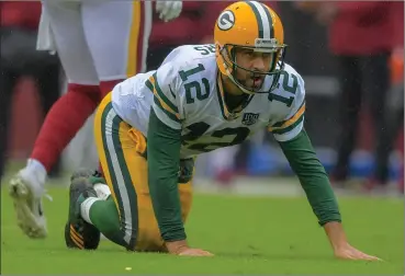  ?? File photo ?? Green Bay Packers quarterbac­k Aaron Rodgers, above, passed for a pair of touchdowns and ran for a one-yard score in Saturday afternoon’s 32-18 victory over the Los Angeles Rams to advance to the NFC Championsh­ip Game.