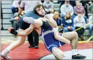  ?? NATE HECKENBERG­ER - FOR MEDIANEWS GROUP ?? Spring-Ford’s James McGill works against Pennridge’s Brady McMahon, in a 3-1 win at 145 pounds.