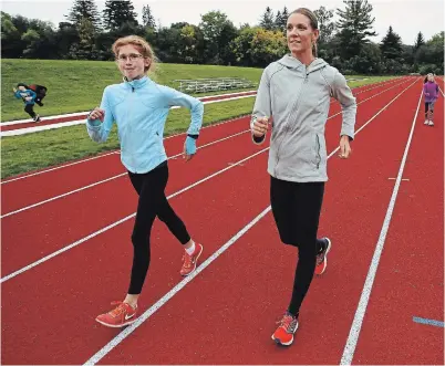  ?? CLIFFORD SKARSTEDT/EXAMINER FILE PHOTO ?? Canadian youth racewalk champion Audrey McCarthy (left) joins Olympic racewalker Rachel Seaman for a clinic on Oct. 3, 2018. McCarthy is off to university in West Virginia.