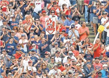  ?? DAVID RICHARD, USA TODAY SPORTS ?? Fans celebrate after Cleveland beat Detroit to set the American League record with 21 consecutiv­e wins.