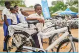  ?? ?? HWANGE, Zimbabwe: A learner poses for a portrait after receiving a bicycle at Mabale Primary near Hwange National Park in Hwange. — AFP