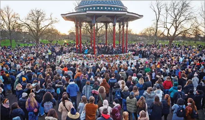  ??  ?? SHOW OF UNITY: Hundreds defy Covid restrictio­ns – to the dismay of police – to pay their respects and highlight the issue of violence against women, near to the spot where Sarah Everard was last seen