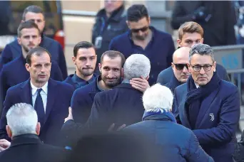  ??  ?? Juventus manager Massimilia­no Allegri (left) and defender Giorgio Chiellini arrive for the funeral of Fiorentina captain Davide Astori in Florence yesterday. — Reuters