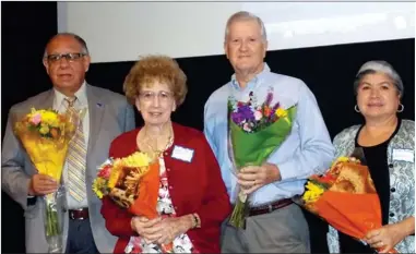  ?? RECORDER FILE PHOTO ?? Larry Lindgren (center-right) celebrates his 2014 Small Business of the Year Award by posing for a photo with other award recipients after the ceremony.