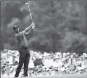  ?? Associated Press ?? MAJOR WIN Tiger Woods hits on the 12th hole during the final round for the Masters golf tournament on April 14 in Augusta, Ga.