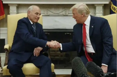  ?? EVAN VUCCI — THE ASSOCIATED PRESS ?? President Donald Trump talks with new White House Chief of Staff John Kelly after he was privately sworn in during a ceremony in the Oval Office with President Donald Trump, Monday in Washington.