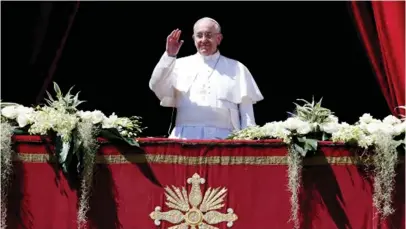  ??  ?? Pope Francis waves as he arrives to deliver the Urbi et Orbi (to the city and the world) benedictio­n at the end of the Easter Mass in Saint Peter’s Square at the Vatican yesterday.