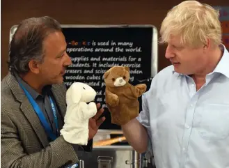  ??  ?? Puppet master: Boris Johnson visits a Unicef site in Copenhagen yesterday