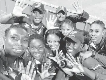  ??  ?? The victorious West Indies women celebratin­g last night