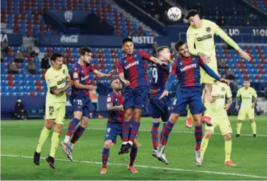  ?? Reuters ?? ↑
Levante and Atletico Madrid players in action during their Spanish League match on Wednesday.