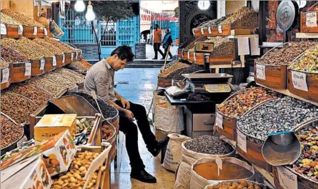  ?? CAROLYN COLE/LOS ANGELES TIMES PHOTOS ?? Ali Rezaei, 36, co-owner of a dried fruit shop, said the Iranian government “wanted to give hope to the people after so many years. That’s why people’s expectatio­ns were so high.”