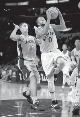  ?? Sean M. Haffey Getty Images ?? KYLE KUZMA isn’t showing any of the Lakers’ improved defense on this drive by C.J. Miles, but his strong play off the bench earned him minutes in crunch time.