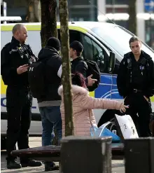  ??  ?? Police order a crowd to disperse in Manchester yesterday