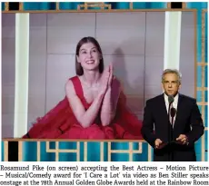  ??  ?? Rosamund Pike (on screen) accepting the Best Actress – Motion Picture – Musical/Comedy award for ‘I Care a Lot’ via video as Ben Stiller speaks onstage at the 78th Annual Golden Globe Awards held at the Rainbow Room in New York.