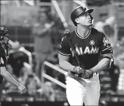  ?? PEDRO PORTAL/TRIBUNE NEWS SERVICE ?? The Miami Marlins' Giancarlo Stanton hits a solo home run, his 52nd of the season, against the Philadelph­ia Phillies in Miami on Sept. 2.