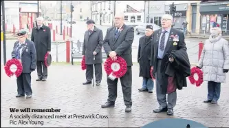  ??  ?? We will remember
A socially distanced meet at Prestwick Cross. . Pic: Alex Young