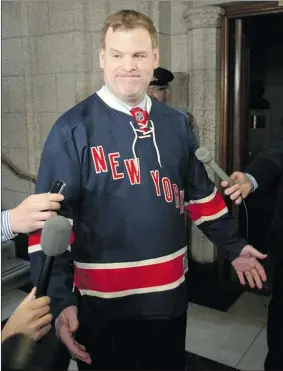  ?? PAT MCGRATH OTTAWA CITIZEN ?? Foreign Affairs Minister John Baird wears a Rangers jersey to Parliament Hill on Friday after he lost a bet with U.S. Secretary of State Hillary Clinton over the Senators-rangers series.
