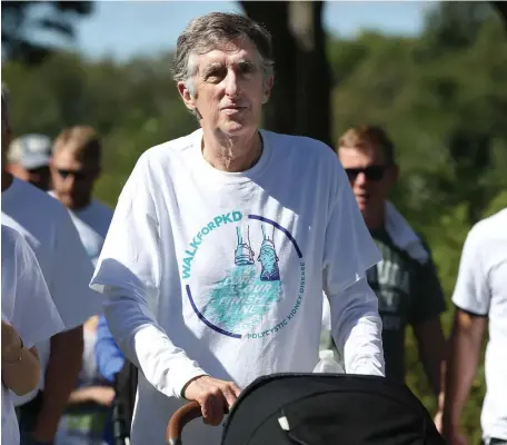  ?? NAncy lAnE / HERAlD STAff filE ?? STAYING SAFE: John Nucci pushes his grandchild’s carriage at the Boston Walk for PKD with his family on Sept. 15, 2019, in Boston. Below, Nucci poses for a photo with Kerri Abrams, a family friend who donated a kidney to him.