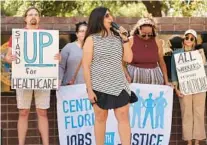  ?? RICARDO RAMIREZ BUXEDA/ORLANDO SENTINEL ?? Rep. Anna Eskamani speaks during a rally featuring Orange County elected officials and community leaders in front of the State of Florida Regional Service Center, to call for closing the health insurance coverage gap, on Thursday.