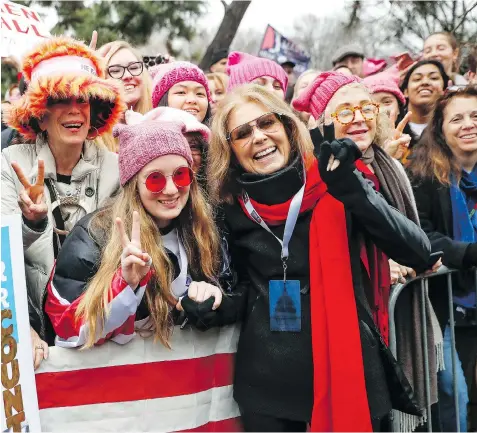  ?? THE ASSOCIATED PRESS ?? “There is only one Gloria Steinem,” novelist Meg Wolitzer says of the American journalist and feminist, seen in a red scarf at the 2017 Women’s March on Washington. “But I want to live in a world in which there are a lot of famous feminists, so I...