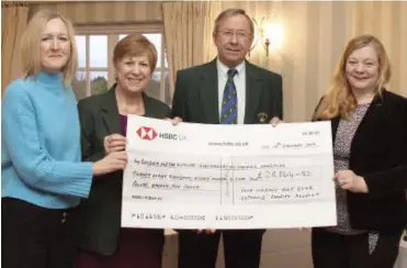  ??  ?? Mandy Barter (left) from My Cancer My Choices and Jane Holmes from Building For The Future (far right) receive a cheque from Sand Martin Golf Club captains Pauline Ronson and Alan Norman