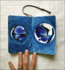  ?? AMY MARICLE — MINDFUL ART STUDIO VIA AP ?? This April 2017 photo provided by Mindful Art Studio in Foxboro, Mass., shows a journal entry called “Portals,” with acrylic paint and mixed media paper on a 3.5 x 5.5 inch journal page.