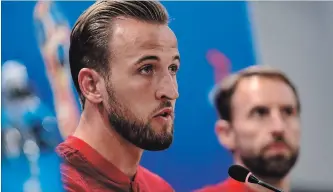  ?? ALASTAIR GRANT THE ASSOCIATED PRESS ?? England’s Harry Kane answers a question at a news conference for the 2018 soccer World Cup in Volgograd, Russia, on Sunday. England plays Tunisia in a group G match Monday.