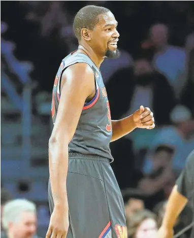  ?? RONALD MARTINEZ/GETTY IMAGES ?? Kevin Durant had a lot to smile about in the All-Star Game, including a beautifull­y timed lob to Russell Westbrook.