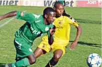  ??  ?? FC Platinum’s Marshal Mudehwe (left) vies for the ball against Bulawayo City’s Humphrey Ncube during a soccer league match at Barbourfie­lds Stadium yesterday