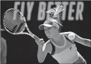  ??  ?? Sofia Kenin of the U.S. makes a forehand return to Tunisia's Ons Jabeur during their quarterfin­al match Tuesday at the Australian Open. Kenin won to advance to the semifinals in Melbourne. [AP PHOTO/ANDY BROWNBILL]