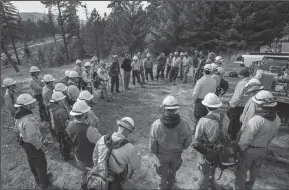  ?? STEVE RINGMAN/SEATTLE TIMES ?? Fire crews from the state, forest service, local and British Columbia are undergoing prescribed fire training in the area above Roslyn, Wa., to learn how to use fire to revive a forest’s health.