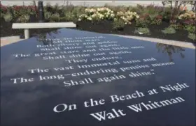  ?? PHOTOS BY FRANK ELTMAN — ASSOCIATED PRESS ?? A table containing the Walt Whitman poem “On the Beach at Night” is part of a new memorial being dedicated today in Point Lookout, N. Y., on the 16th anniversar­y of the Sept. 11, 2001, terror attacks.