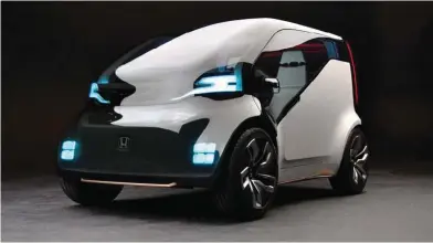  ??  ?? ⇧ The NEUV is an urban electric vehicle desisgned to suit right sharing.