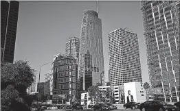  ?? [JAE C. HONG/THE ASSOCIATED PRESS] ?? Traffic moves past the 73-story, 1,100-foot-high Wilshire Grand Center in Los Angeles.