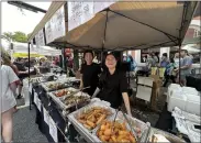  ?? JEN SAMUEL — FOR THE DAILY LOCAL NEWS ?? Lily Sushi & Grill serves artisan food during the 38th Mushroom Festival on Sunday in Kennett Square.