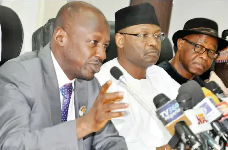  ?? Photo: Felix Onigbinde ?? From left: Acting Chairman, Economic and Financial Crimes Commission (EFCC), Ibrahim Magu; National Chairman, Independen­t National Electoral Commission (INEC), Prof Mahmood Yakubu; and INEC National Commission­er, Dr. Mustafa Lecky, during the EFCC...