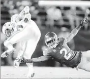  ?? Robert Gauthier
Los Angeles Times ?? USC’S Adoree’ Jackson (2) tries to tackle Nebraska’s Kenny Bell at Holiday Bowl; Jackson returned a kickoff for a touchdown and scored again in the game.