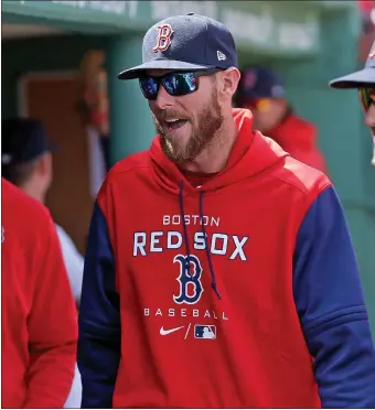  ?? MATT STONE / HERALD STAFF FILE ?? DELAYED RETURN: Injured pitcher Chris Sale walks in the dugout during a game against the Toronto Blue Jays at Fenway Park on April 21.